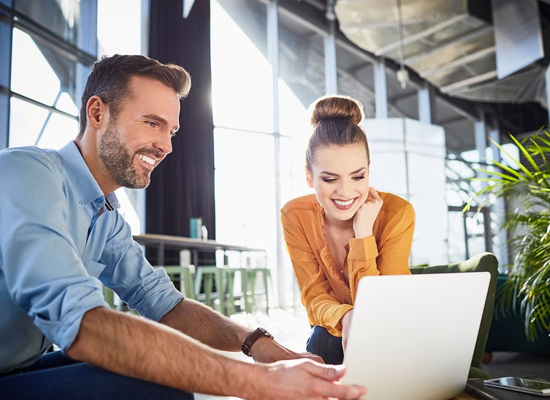 Provide Feedback - Agent and Client Sitting Together in an Office Building